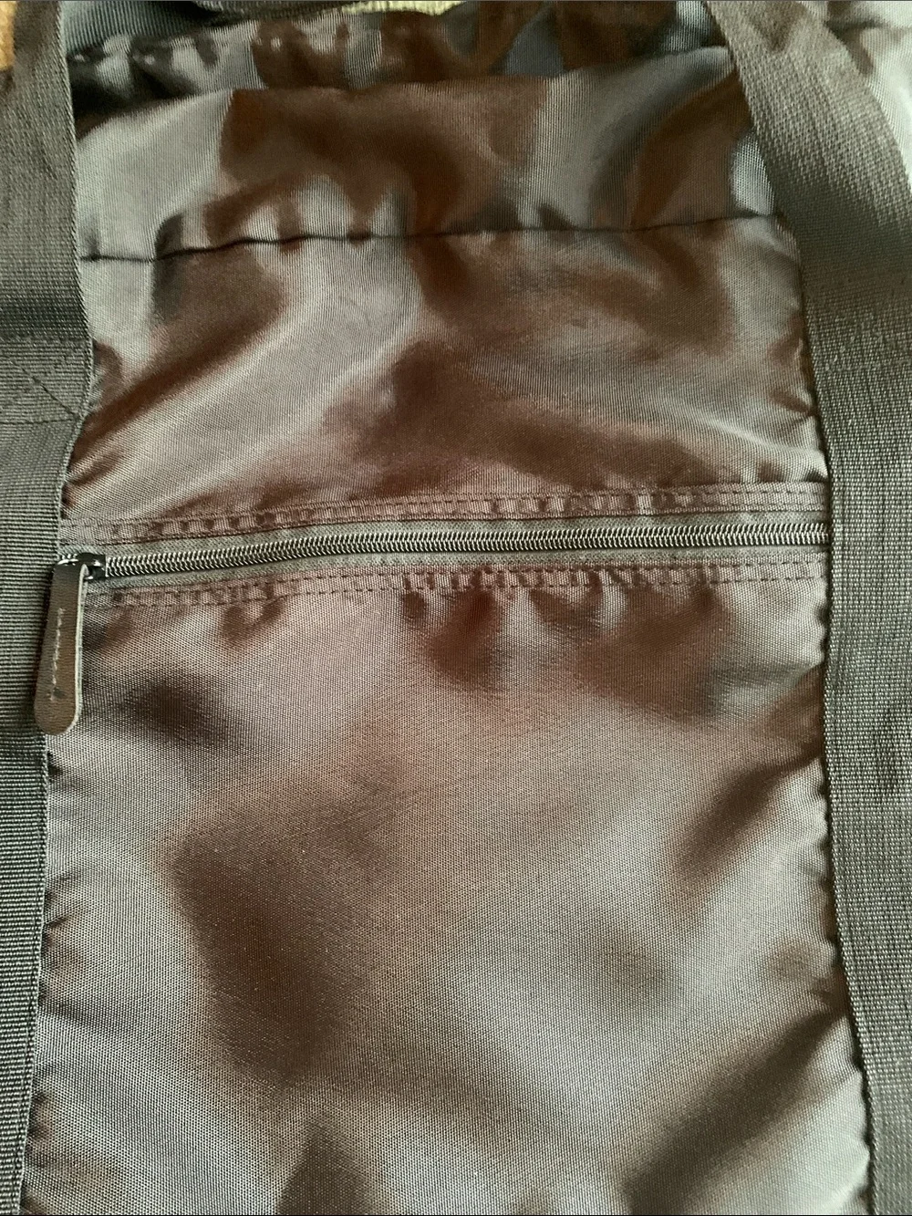 EUC black nylon duffel bag with strap. Approximately 22” x 14” x 10.5”